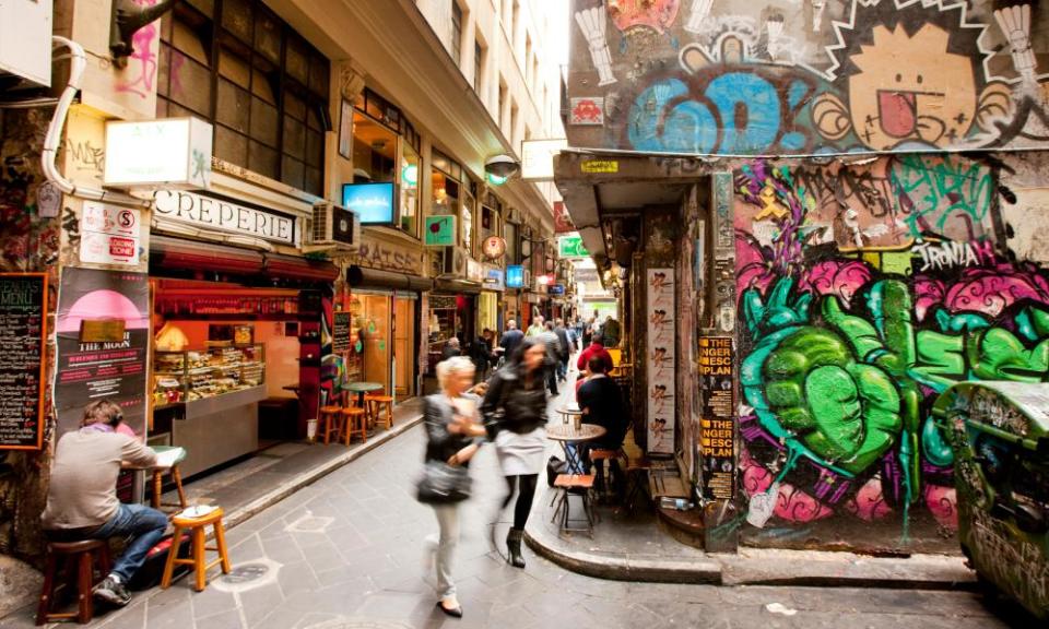 Busy city laneways, with cafes and graffitti, Melbourne, Victoria, Australia