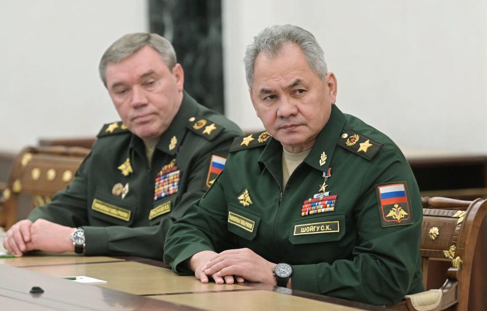 Russian Defence Minister Sergei Shoigu (R) and chief of the general staff Valery Gerasimov attend a meeting with Russian President in Moscow on February 27, 2022.