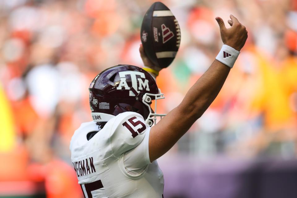 Texas A&M quarterback Conner Weigman celebrates after scoring a touchdown against Miami early in the 2023 season. Weigman is trying to come back from a foot injury that sidelined him after four starts.