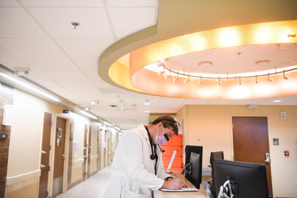 Dr. Ben Bevill works with patients' medical charts at the University of Tennessee Medical Center.
