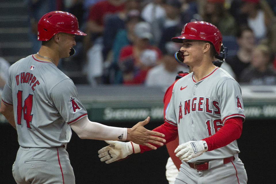 Los Angeles Angels' Logan O'Hoppe (14) congratulates Micky Moniak, right, after his three-run home run off Cleveland Guardians starting pitcher Tanner Bibee during the inning of a baseball game in Cleveland Friday, May 3, 2024. (AP Photo/Phil Long)