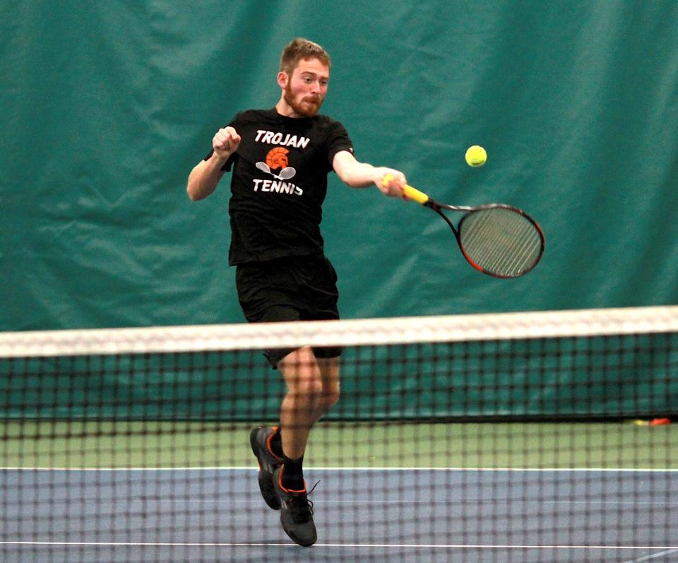 Preston Gump of Sturgis hits a return shot in one of his matches at the state finals on Friday.