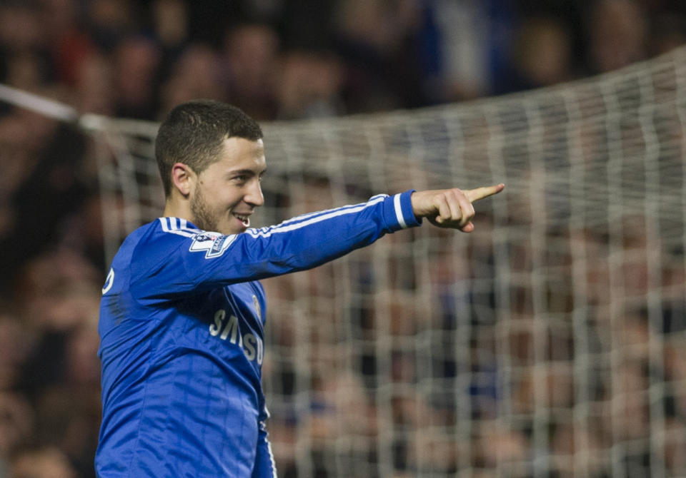 Chelsea's Eden Hazard celebrates after scoring against Tottenham Hotspur during their English Premier League soccer match, at the Stamford Bridge Stadium in London, Saturday March 8, 2014. (AP Photo/Bogdan Maran)