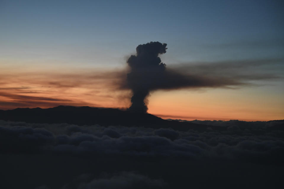 In this photo provided by the Spanish government and taken from a plane carrying Spain's Prime Minister Pedro Sanchez, a volcano erupts on the island of La Palma in the Canaries, Spain, Sunday Sept. 19, 2021. Lava continues to flow slowly from a volcano that erupted in Spain’s Canary Islands off northwest Africa. The head of the islands' regional government said Monday he expects no injuries to people in the area after some 5,000 were evacuated.(Borja Puig de la Bellacasa/Spanish Government via AP)