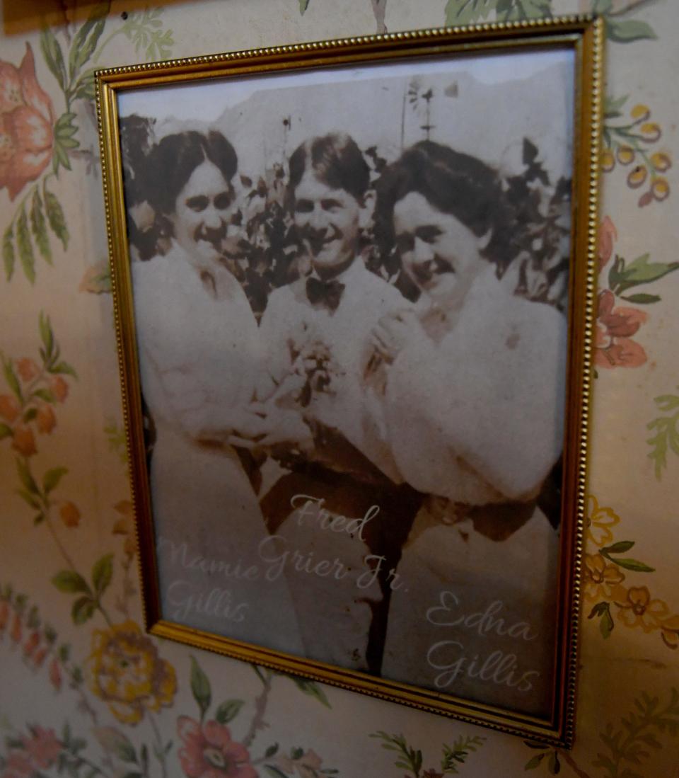 On the wall of the Gillis-Grier Bed and Breakfast hangs a photo of Mamie and Edna Gillis with Fred Grier Jr. Feb. 23, 2024, in Salisbury, Maryland.