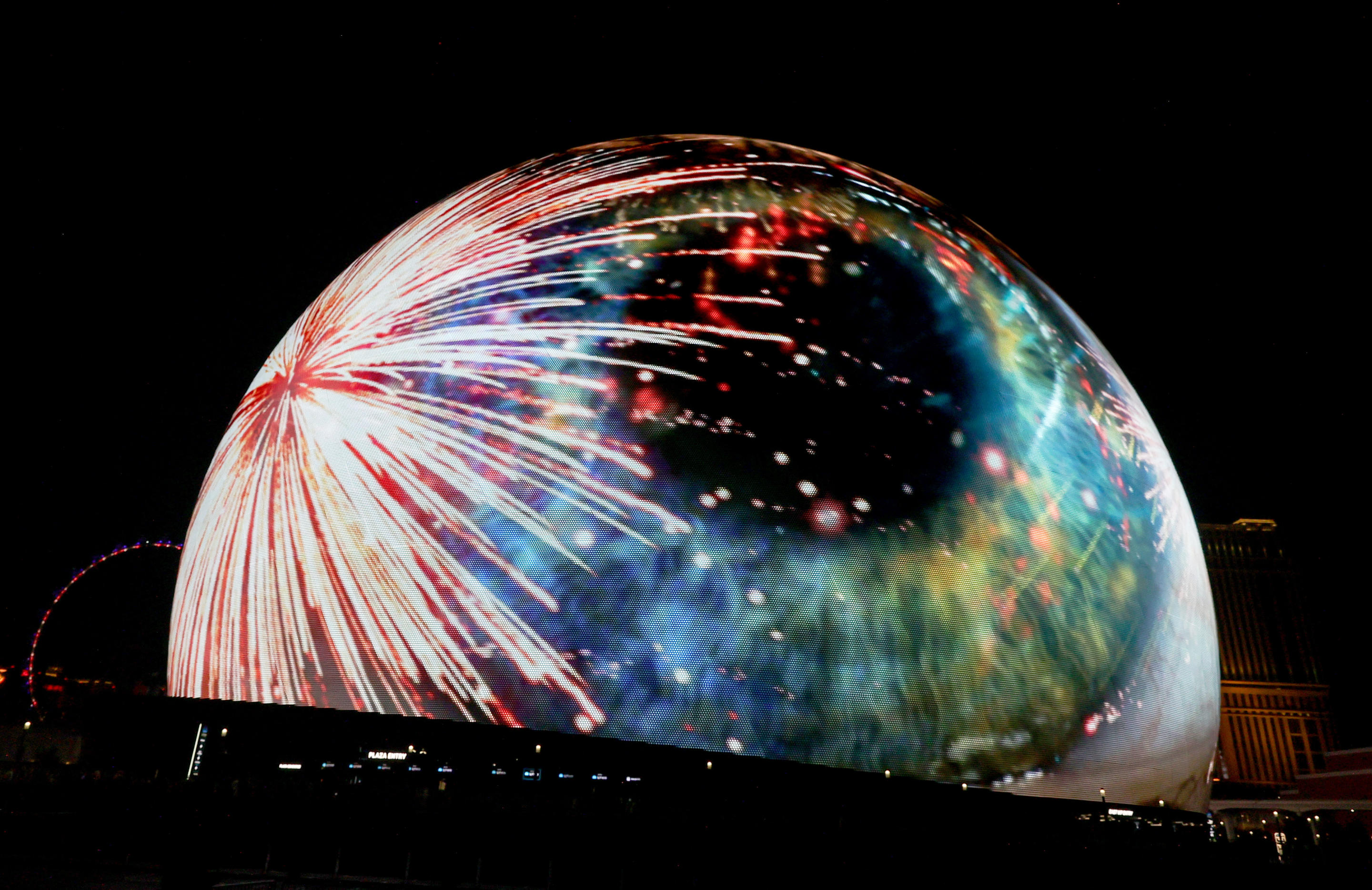 An image of a human eye and fireworks lights up the 580,000-square-foot Exosphere at the Sphere.