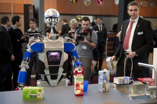 A robot said to be able to cook takes stock of groceries at CeBIT, the world's biggest high-tech fair on March 6, 2012 in Hanover, Germany. Water-powered clocks, eye-controlled arcade games and pole-dancing robots: this year's CeBIT tech fair, the world's biggest, showcased gadgets ranging from the useful to the downright nerdy