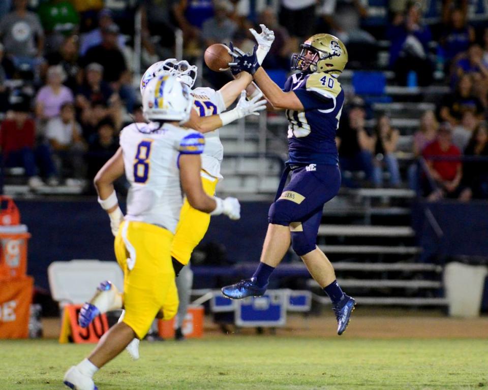 Serra defender Brooks Trimmer breaks up a pass intended for Central Catholic’s Christiopher Early (40) during a game between Central Catholic and Serra at Central Catholic High School in Modesto, California, on September 8, 2023.