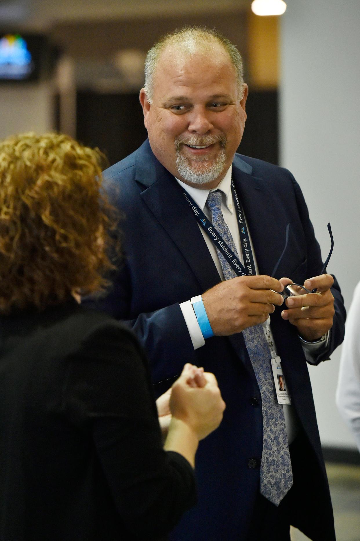 Former Lee County schools Superintendent Christopher Bernier chats during a meet-and-greet event held last week at EverBank Stadium for people to meet Bernier and Daniel Smith, the other finalist for the Duval County school superintendent's job.