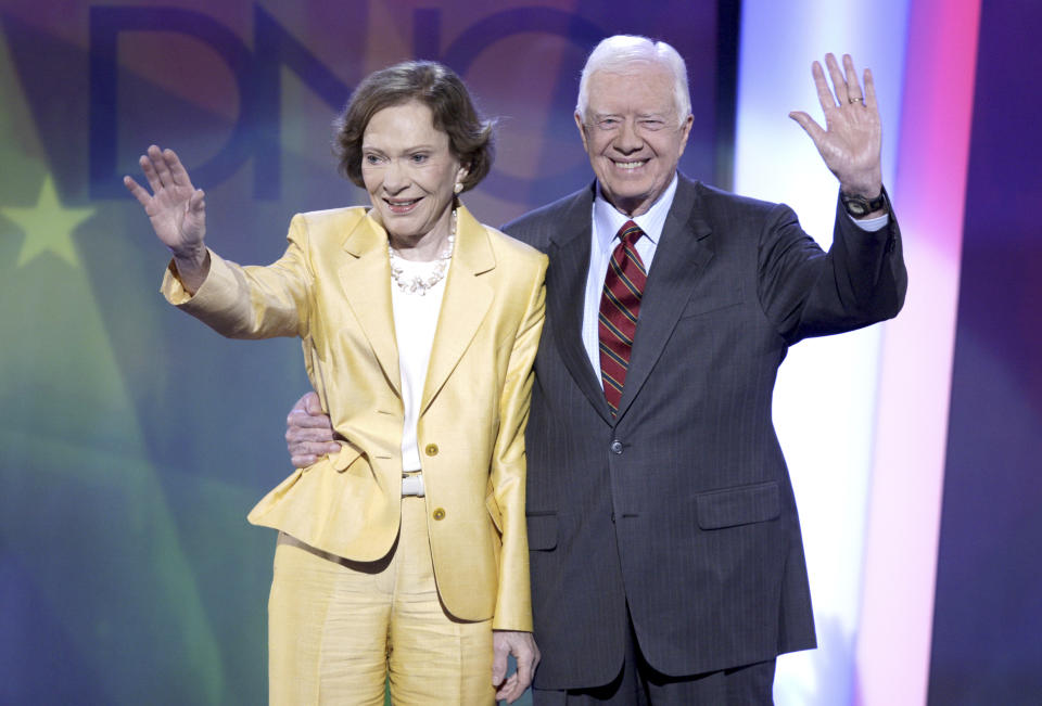 FILE - Former President Jimmy Carter, right, and his wife, former first lady Rosalynn Carter, wave to the audience at the Democratic National Convention in Denver, Aug. 25, 2008. Rosalynn Carter, the closest adviser to Jimmy Carter during his one term as U.S. president and their four decades thereafter as global humanitarians, died Sunday, Nov. 19, 2023. She was 96. (AP Photo/Ron Edmonds, File)