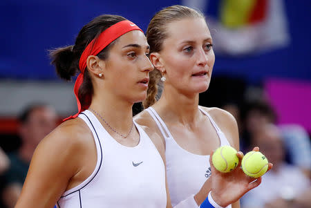 Tennis - Fed Cup - World Group Semi-Final - France v Romania - Kindarena, Rouen, France - April 21, 2019 France's Kristina Mladenovic and Caroline Garcia during their doubles match against Romania's Simona Halep and Monica Niculescu REUTERS/Charles Platiau