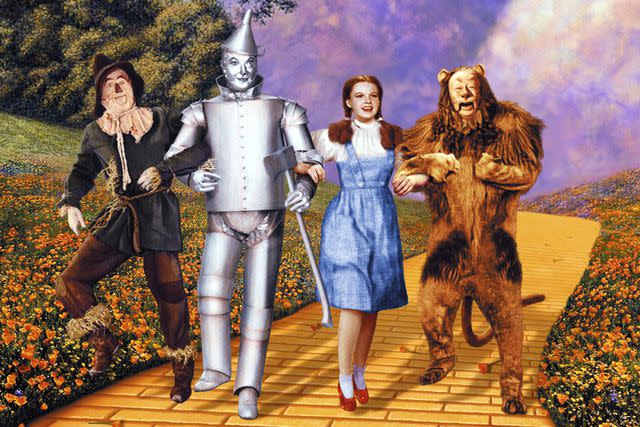 <p>Silver Screen Collection/Getty</p> Ray Bolger, Jack Haley, Judy Garland and Bert Lahr in 'The Wizard of Oz'