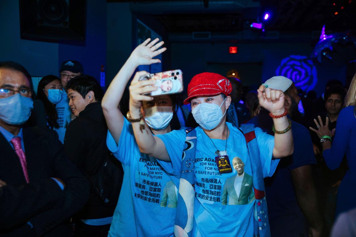 Supporters of mayoral candidate Eric Adams take a selfie during Adams' election party on Tuesday, June 22, 2021, in New York.