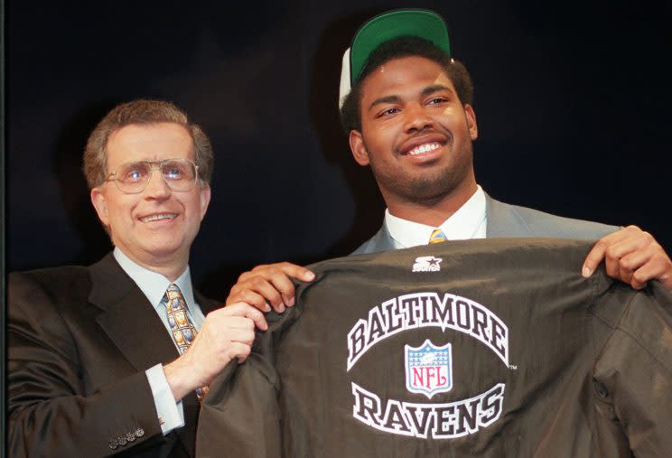 Jonathan Ogden shows off a generic Ravens jacket on draft day in 1996. The team didn't yet have a mascot, a moment Ogden still laughs at today. (AP)