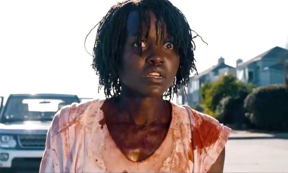 Lupita Nyong'o in Us, covered in blood and looking frantic