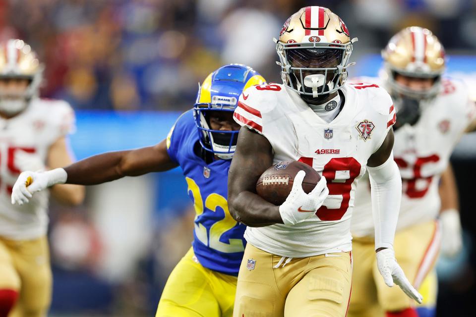 Deebo Samuel #19 of the San Francisco 49ers runs after a catch for a touchdown in the second quarter against the Los Angeles Rams in the NFC Championship Game at SoFi Stadium on January 30, 2022 in Inglewood, California.