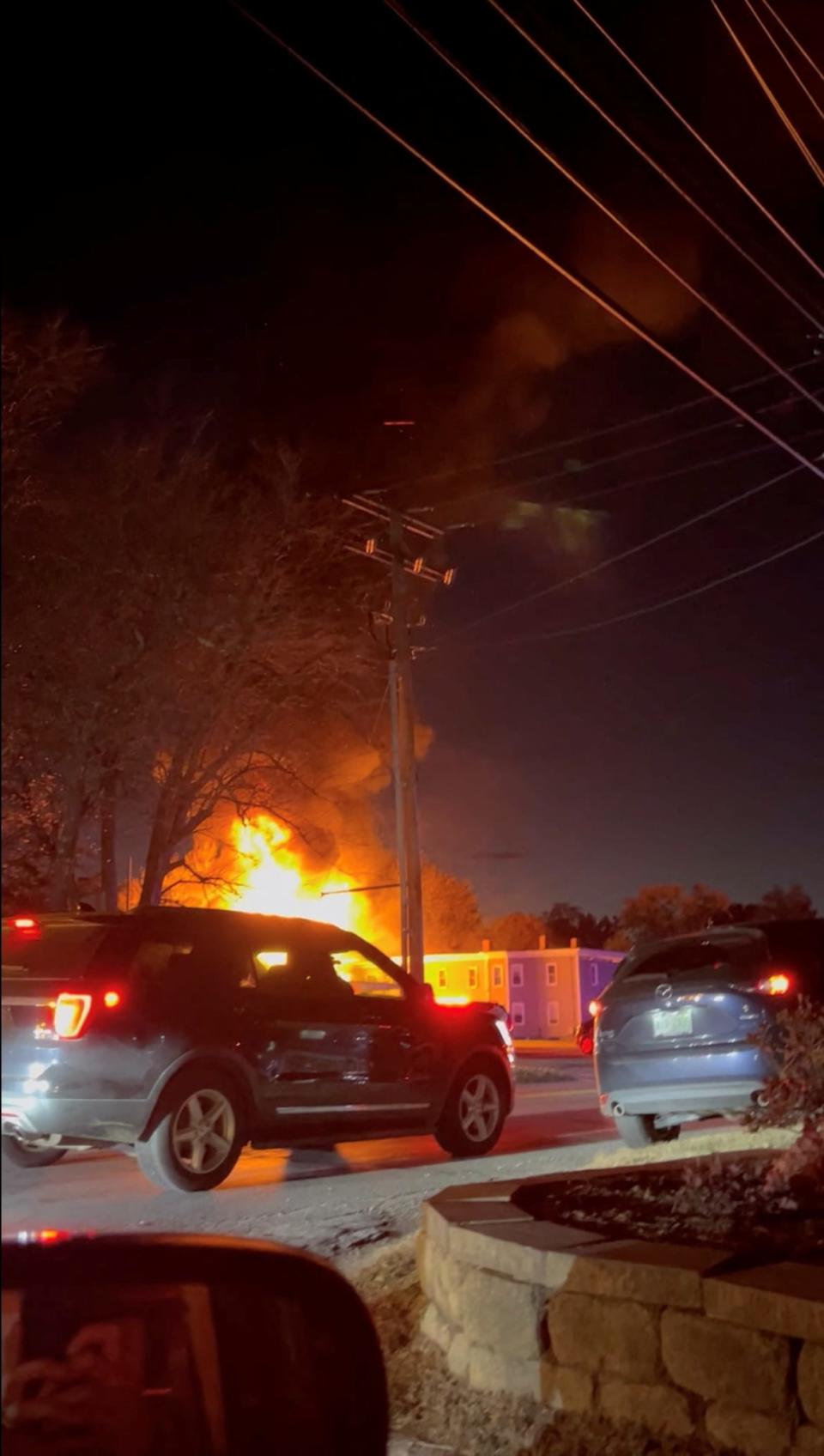 <div class="inline-image__caption"><p>Emergency vehicles stand on the road outside of a burning building after a plane crashed into a building in Keene, New Hampshire.</p></div> <div class="inline-image__credit">SHAUGHN CALKINS</div>