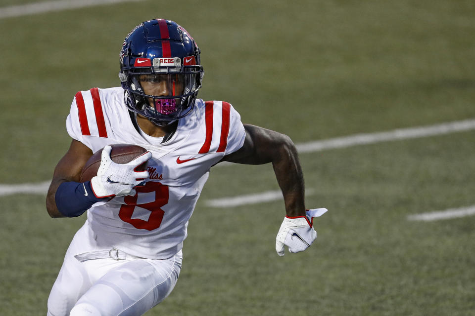 FILE - Mississippi wide receiver Elijah Moore (8) runs for yardage during an NCAA college football game against Vanderbilt in Nashville, Tenn., in this Saturday, Oct. 31, 2020, file photo. Moore is a possible first round pick in the NFL Draft, April 29-May 1, 2021, in Cleveland. (AP Photo/Wade Payne, File)