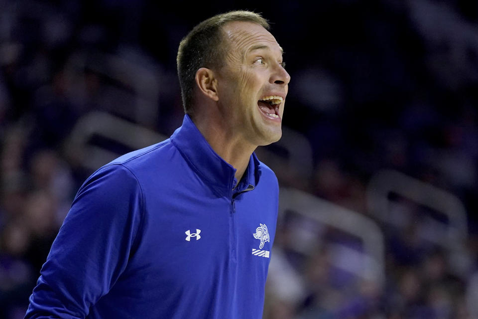 South Dakota State head coach Eric Henderson talks to his players during the first half of an NCAA college basketball game against Kansas State Monday, Nov. 13, 2023, in Manhattan, Kan. (AP Photo/Charlie Riedel)