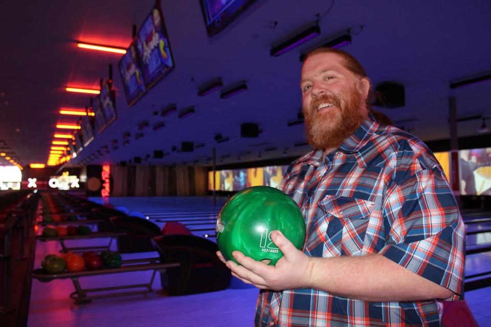 Jacob Bennett, district manager for Lucky Strike, holds a ball at the new Moorpark bowling alley on Thursday.