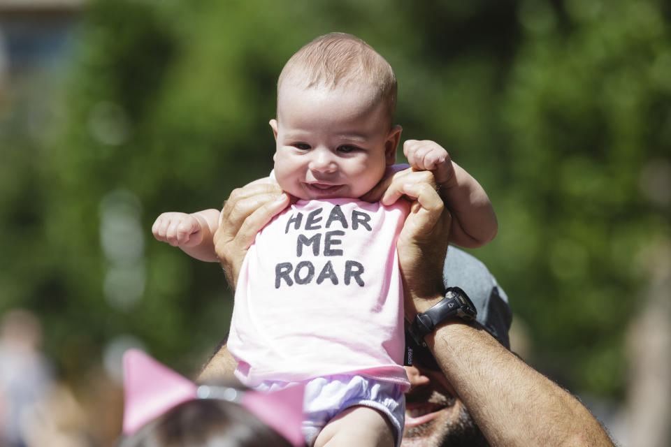 An infant is held aloft at a protest against new U.S. President Donald Trump on January 21, 2017 in Sydney, Australia.&nbsp;