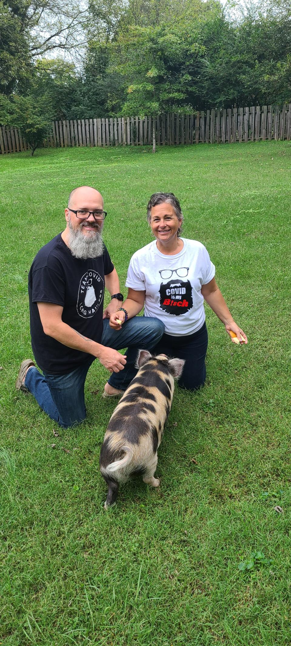 Travis and Shannon Exum with pet pig Tony, the mascot of Team COVID Long Haul. Oct. 12, 2021