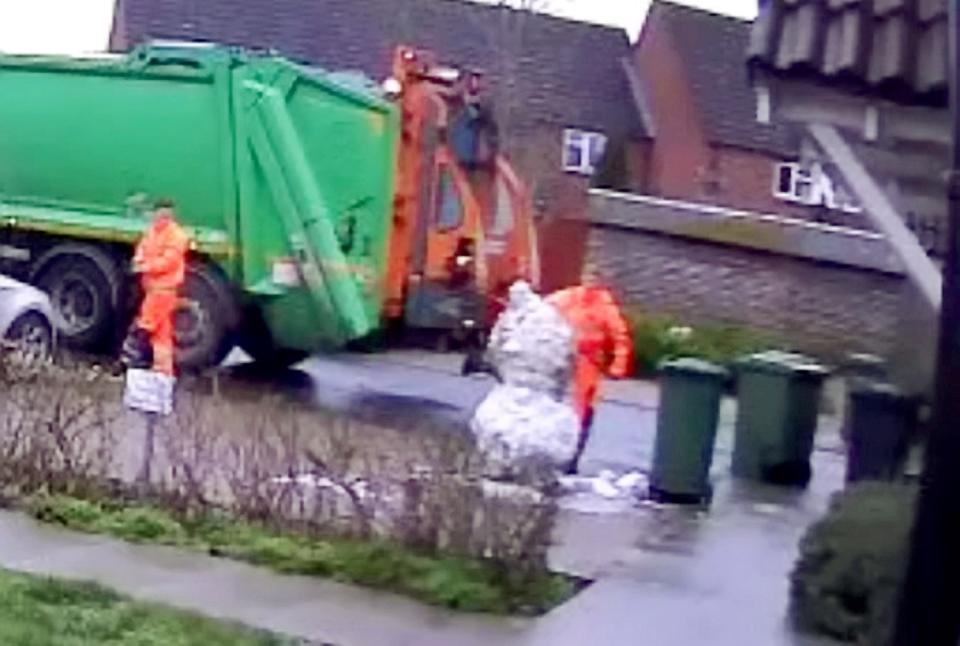 Three-year-old Joseph Taylor was left in floods of tears after watching a grinning binman boot the head off his 7ft-tall snowman (SWNS)