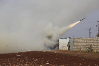 FILE - In this Feb. 14, 2020, file photo Turkish soldiers fire a missile at Syrian government position in the province of Idlib, Syria. Syria’s civil war has long provided a free-for-all battlefield for proxy fighters. But in its ninth year, the war is drawing major foreign actors into direct conflict, with the threat of all-out confrontations becoming a real possibility. (AP Photo/Ghaith Alsayed, File)