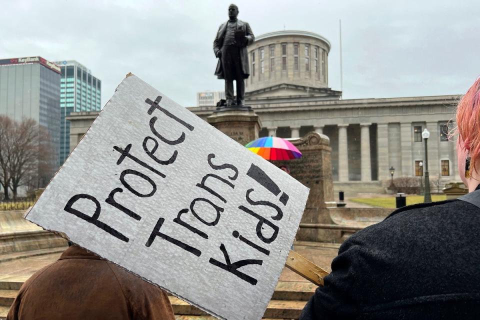 Demonstrators advocating for transgender rights and healthcare stand outside of the Ohio Statehouse on Jan. 24, 2024, in Columbus, Ohio. (AP)