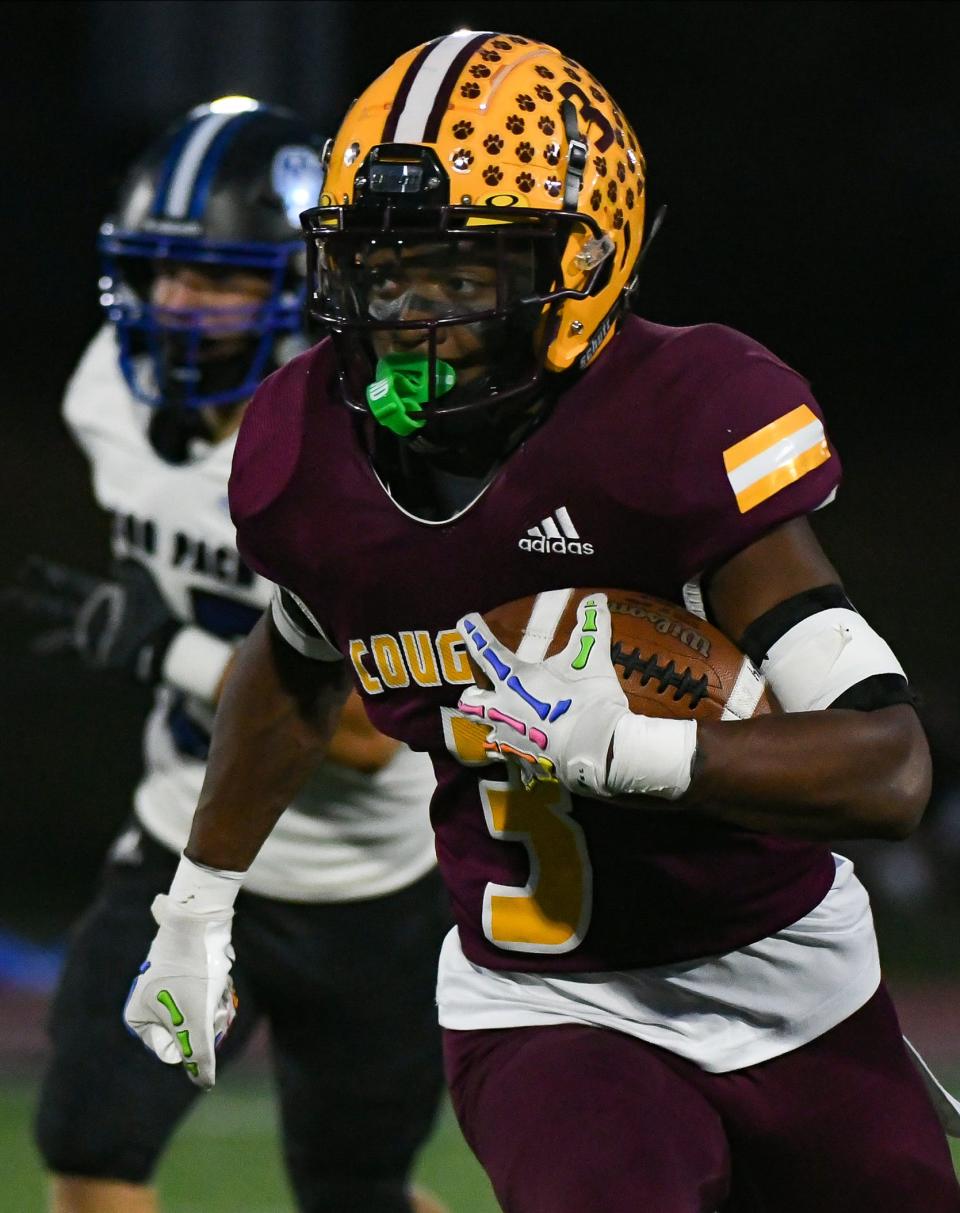 Bloomington North’s Stephon Opoku (3) runs after taking the ball on an end around during the football game against Columbus North at Bloomington North on Friday, Oct. 6, 2023.