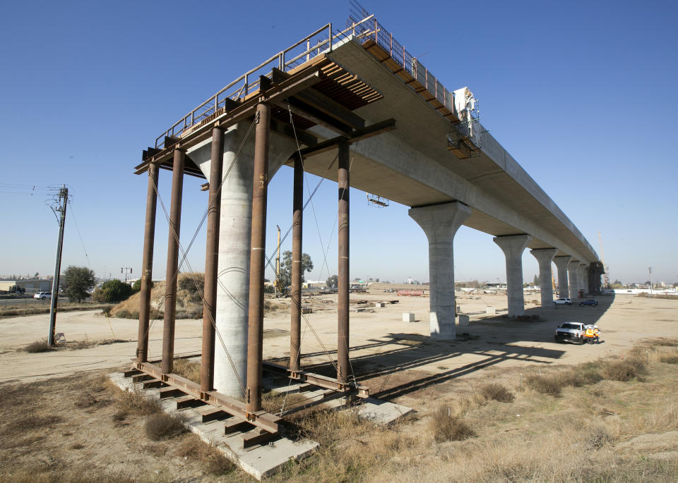 FILE - This Dec. 6, 2017, file photo shows one of the elevated sections of the high-speed rail under construction in Fresno, Calif. The Trump administration said Tuesday, Feb. 19, 2019, that it plans to cancel $929 million awarded to California's high-speed rail project and wants the state to return an additional $2.5 billion that it has already spent. (AP Photo/Rich Pedroncelli, File)