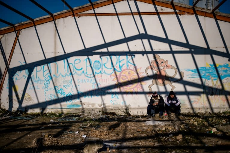 Migrants resting in an abandoned factory in the western Serbian town of Sid are tantalisingly close to the border of EU member Croatia -- but as winter draws in their existence is becoming ever more miserable