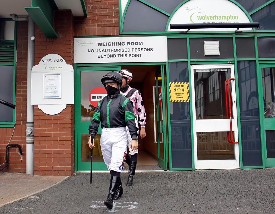 WOLVERHAMPTON, ENGLAND - JUNE 12: Hollie Doyle heads out of the weighing room to the paddock prior to a race at Wolverhampton Racecourse on June 12, 2020 in Wolverhampton, England. (Photo by Steve Davies/Pool via Getty Images)