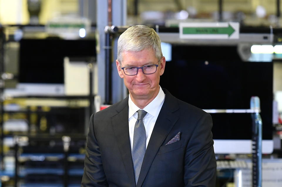 Apple CEO Tim Cook speak to the press during a tour of the Flextronics computer manufacturing facility, with US President Donald Trump, where Apple's Mac Pros are assembled in Austin, Texas, on November 20, 2019. (Photo by MANDEL NGAN / AFP) (Photo by MANDEL NGAN/AFP via Getty Images)