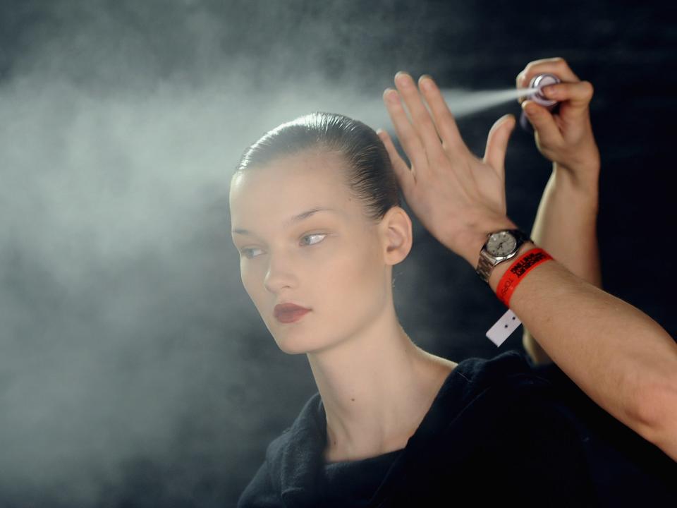 Model prepares backstage before the Richard Nicoll fashion show as part of London Fashion Week in 2010.