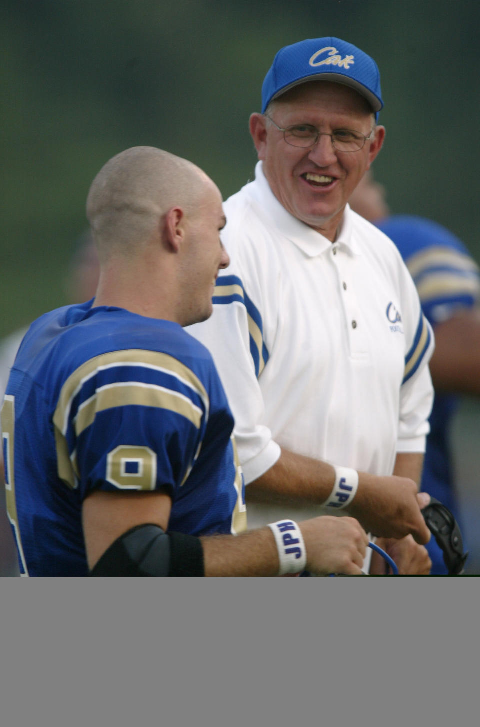 CAK  coach Bill Young laughs with player Taylor Yoakley in 1998.
