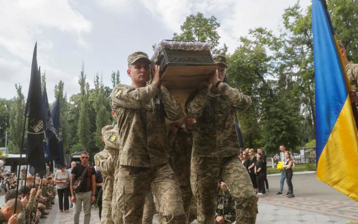 Comrades of late Ukrainian serviceman Mykyta Krasnovyd, call sign &#39;Optymist&#39;, attend his farewell ceremony in Kyiv