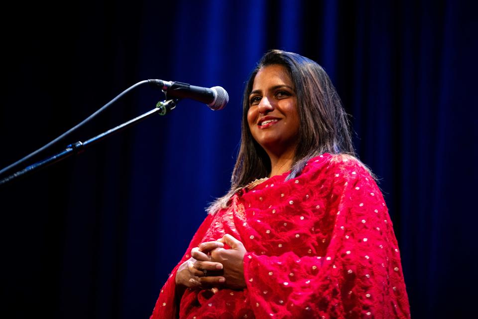 Erlin Kakkanad tells a story during the Des Moines Register Storytellers Project's "Community" show Tuesday, Feb. 27, 2024, at Hoyt Sherman Place in Des Moines.