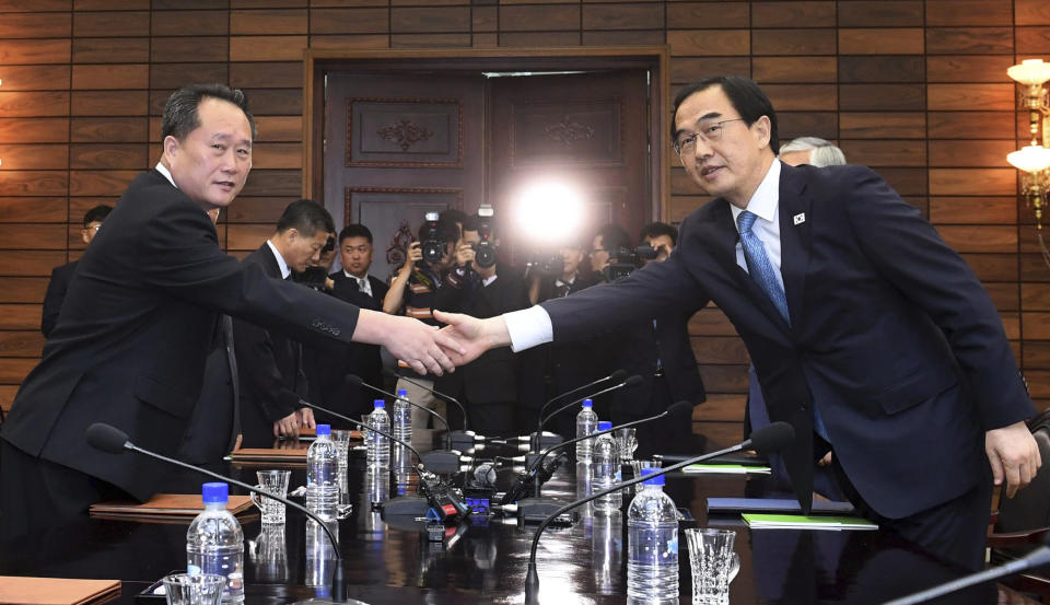 South Korean Unification Minister Cho Myoung-gyon, right, shakes hands with his North Korean counterpart Ri Son Gwon during their meeting at the northern side of Panmunjom in the Demilitarized Zone, North Korea, Monday, Aug. 13, 2018. Senior officials from the rival Koreas met Monday to set a date and venue for a third summit between South Korean President Moon Jae-in and North Korean leader Kim Jong Un, part of an effort to breathe new life into resolving the nuclear standoff between Washington and Pyongyang. (Korea Pool/Yonhap via AP)