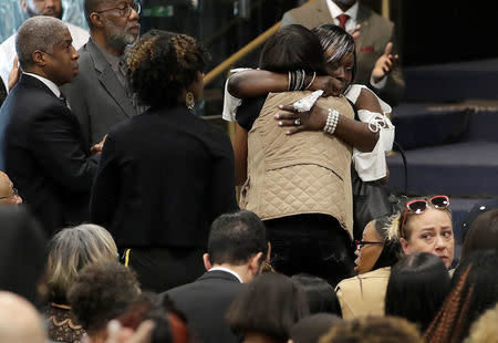 Mourners embrace during the funeral services for police shooting victim Stephon Clark, at Bayside Of South Sacramento Church in Sacramento, California, U.S., March 29, 2018. Jeff Chiu/Pool via Reuters 