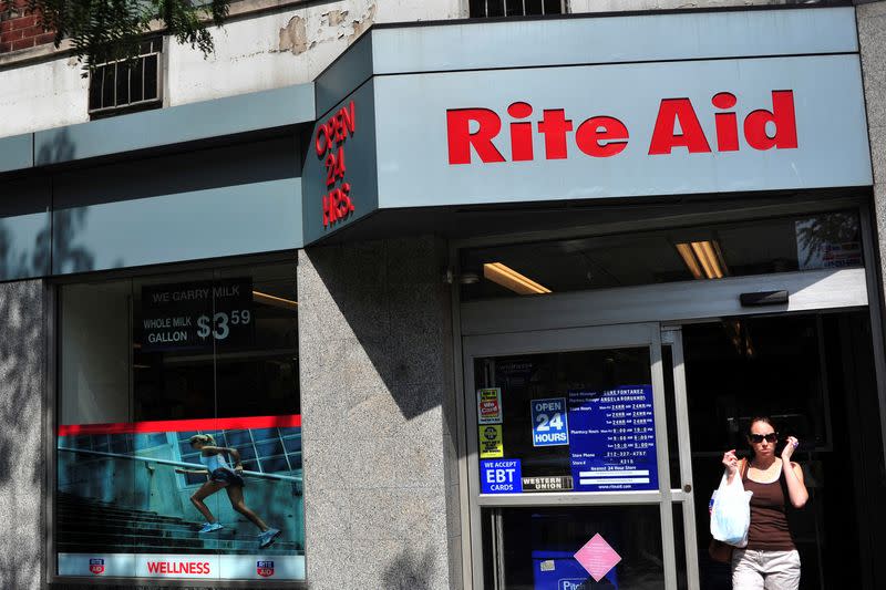 FILE PHOTO: A shopper exits a Rite Aid store in New York