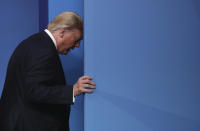 U.S. President Donald Trump walks off the podium after the official group photo during a NATO leaders meeting at The Grove hotel and resort in Watford, Hertfordshire, England, Wednesday, Dec. 4, 2019. NATO Secretary-General Jens Stoltenberg rejected Wednesday French criticism that the military alliance is suffering from brain death, and insisted that the organization is adapting to modern challenges. (AP Photo/Francisco Seco)