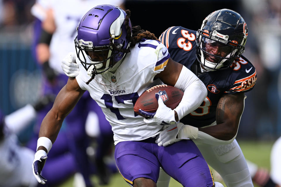 CHICAGO, ILLINOIS – OCTOBER 15: K.J. Osborn #17 of the Minnesota Vikings is tackled by Jaylon Johnson #33 of the Chicago Bears during the first half at Soldier Field on October 15, 2023 in Chicago, Illinois. (Photo by Quinn Harris/Getty Images)