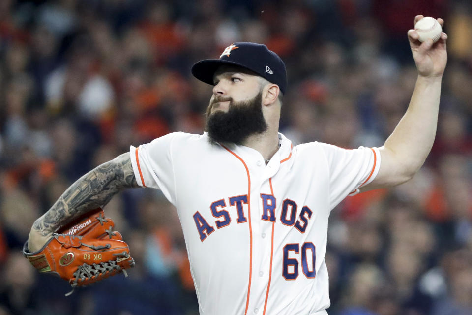 FILE - In this Oct. 16, 2018, file photo, Houston Astros starting pitcher Dallas Keuchel throws against the Boston Red Sox during the first inning in Game 3 of a baseball American League Championship Series in Houston. Pitchers Dallas Keuchel and Craig Kimbrel, the last two top free agents on the market, can sign starting Monday, June 3, 2019, with their new teams having to forfeit amateur draft picks as compensation. Both turned down $17.9 million qualifying offers in November, Keuchel from Houston and Kimbrel from the World Series champion Boston Red Sox. (AP Photo/David J. Phillip, File)