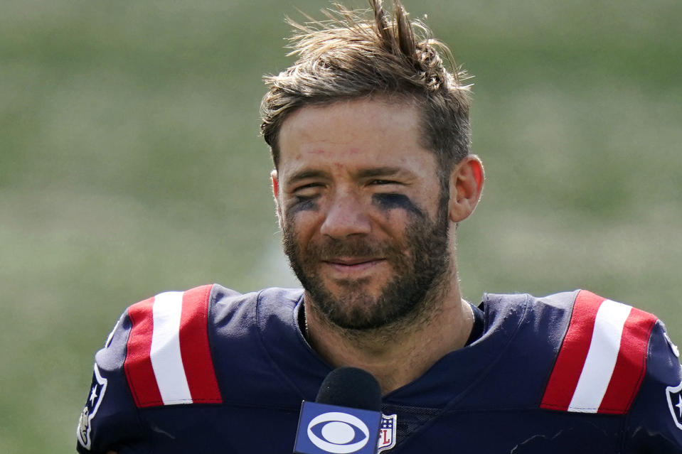 FILE — In this Sunday, Sept. 13, 2020 file photo New England Patriots wide receiver Julian Edelman gives a post-game interview after an NFL football game against the Miami Dolphins, in Foxborough, Mass. The Patriots terminated Edelman's contract with a failed physical designation, Monday, April 12, 2021, according to the NFL's transaction wire. Citing a knee injury that cut his 2020 season short after just six games, Edelman announced Monday that he is retiring from the NFL after 11 seasons. (AP Photo/Steven Senne, File)