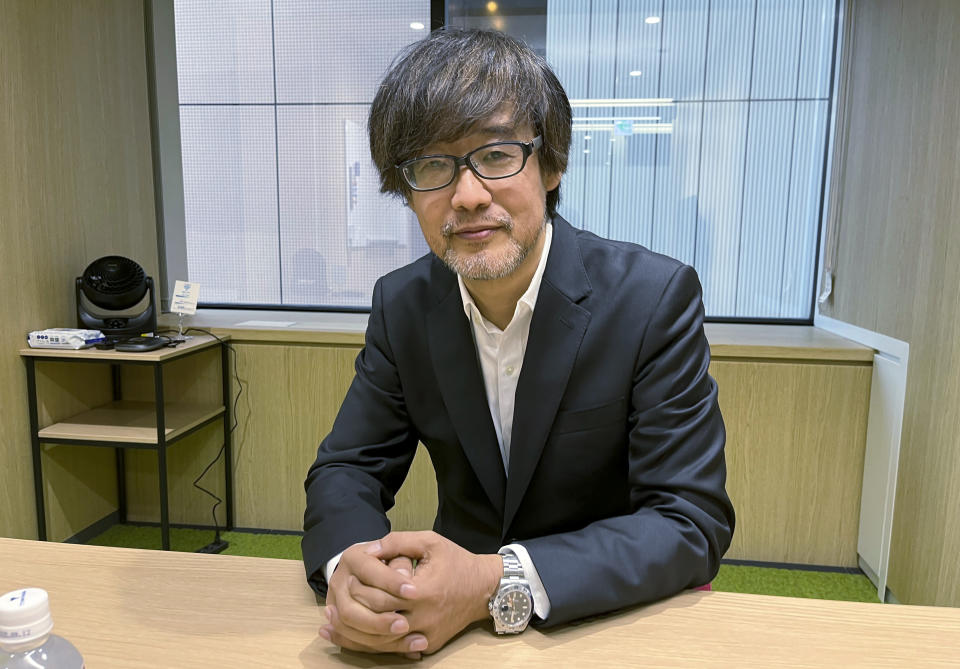 Takashi Yamazaki, director of the new Godzilla film, speaks with The Associated Press at the film studio Toho headquarters office in Tokyo Wednesday, Nov. 1, 2023. Yamazaki, the director behind the latest Godzilla movie, set for U.S. theatrical release later this year, was determined to bring out what he believes is the essentially Japanese spirituality that characterizes the 1954 original. (AP Photo/Yuri Kageyama)