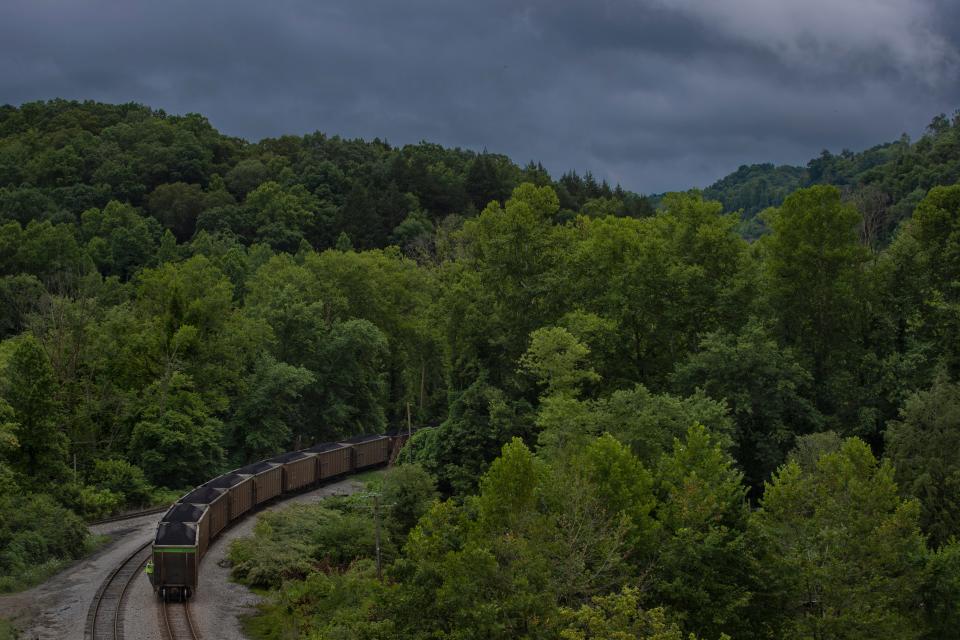 A coal trail moves alongside KY-990 in Harlan County away from the JRL Coal mining operation. July 17, 2019