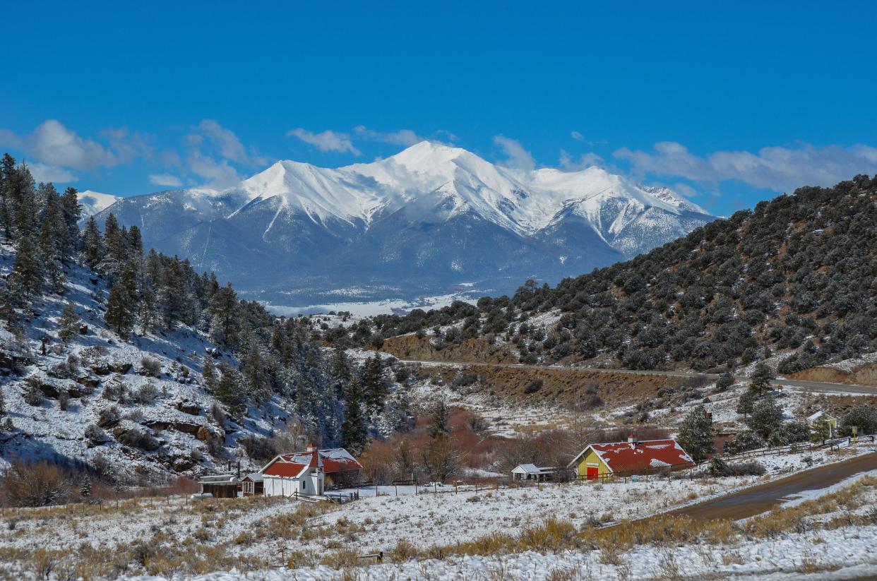 View of Colorado mountain peaks with fresh snow which fell a few hours earlier. Mount Yale, 14199 feet in center.