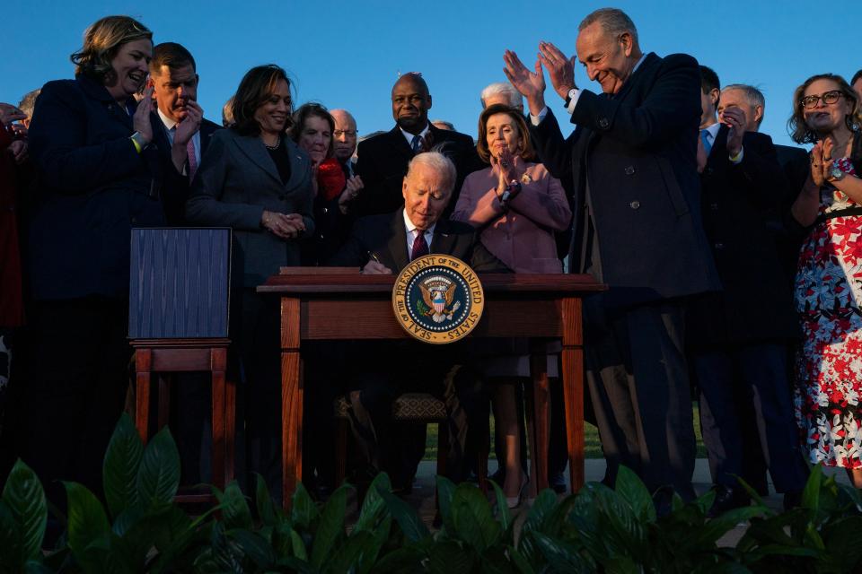 President Joe Biden signs the "Infrastructure Investment and Jobs Act" during an event on the South Lawn of the White House, Monday, Nov. 15, 2021, in Washington. (AP Photo/Evan Vucci)