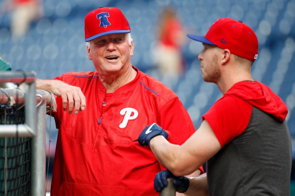 Philadelphia Phillies batting coach Charlie Manuel, left talks with Corey Dickerson, right, during batting practice before the first inning of a game against the Chicago Cubs, Wednesday, Aug. 14, 2019, in Philadelphia.